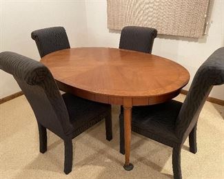 Table with chairs and 3 extra leaves.
