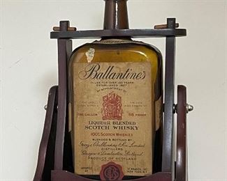 One gallon empty bottle of Ballantine Scotch Whisky in pouring dispenser. 