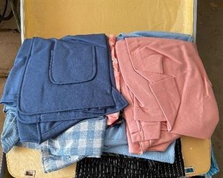 Suitcase full of polyester clothes straight from the 1970's.