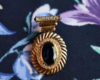 10 CTs Bezel set sapphire w/36 diamonds totaling 1.3 carats. Set in 14k