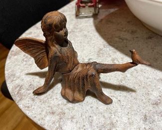 Cast iron fairy with bird on her foot
