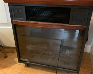 #28	Rolling Electric Fireplace/Heater  Model 201F3g00gf w/remote control    19x12x21	 $40.00 			

