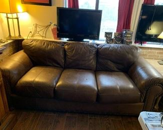 #46	Brown Leather Sofa w/nail head trim - 84"L	 $200.00 			
