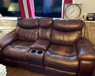 #52	Brown Leather Double Recliner w/center wedge & Cupholders w/continuous legs - 83"Long	 $200.00 			
