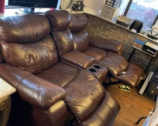 #52	Brown Leather Double Recliner w/center wedge & Cupholders w/continuous legs - 83"Long	 $200.00 			
