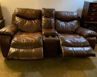 #77	Brown Leather Double Recliner w/center wedge & Cupholders w/continuous legs - 78"Long	 $200.00 			
