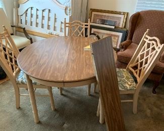 #113	Wood Bamboo Style Round Table w/1 leaf & 4 chairs - 29-39x29T  (chairs need recovering)	 $75.00 			
1 chair not photo