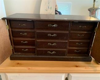 #119	Wood Jewelry Cabinet w/12 drawers - 24x9x12	 $50.00 			

