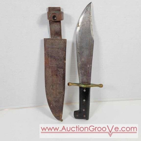 1 WORLD WAR II BOWIE KNIFE. 4 x 16 inches. Marked, Collins Co. LEGITIMUS 18 MADE IN USA with a LEGITIMUS 13 Leather Sheath. WW II era Marine Corps Bowie Knife and Sheath.