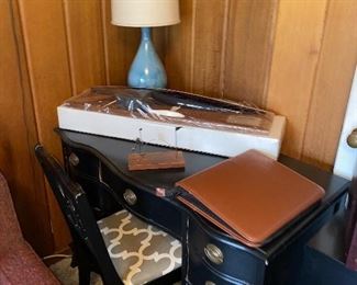Vintage black desk with chair shown with accessories