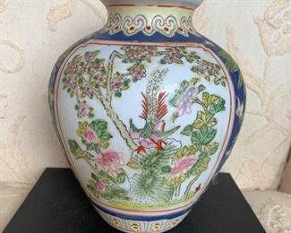 Colorfully decorated ginger jar shaped vase.