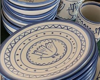 Set of unique stoneware plates, bowls, and mugs with primitive cuckoo bird graphics by Louisville Stoneware.