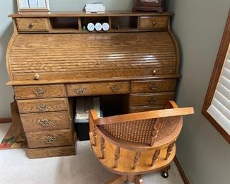 . . . a fine oak roll top desk and desk chair