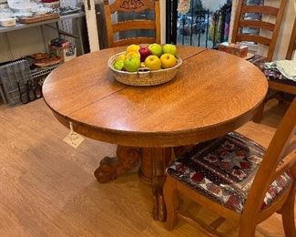 Round oak table with claw feet