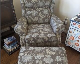 Pretty floral chair with ottoman. The back of the chair does recline. 