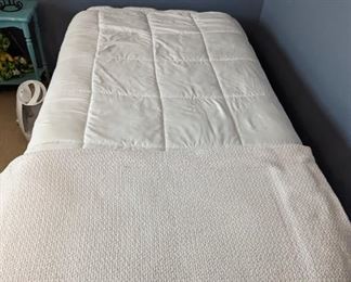 Like new twin mattress and frame. Comforter and blanket included.