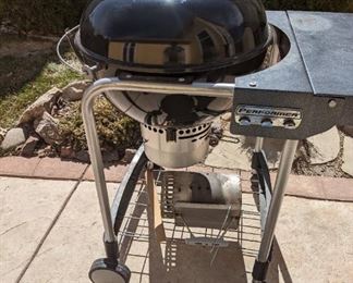 Weber charcoal grill. In good shape. Includes cover.