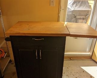 Black kitchen island. The top show wear, was used in the garage.