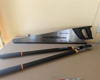 Fiskars trimmer and Sears saw, both in new condition.