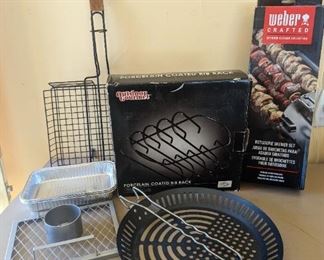 Grill accessories, rib rack, metal skewers, chicken holder, vegetable holder slotted pan. 