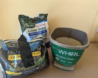 Hand powered seed spreader. Grass seed included.