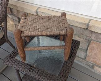 Cute little wooden weaved stool.