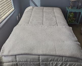 Like new twin mattress and frame. Comforter and blanket included.