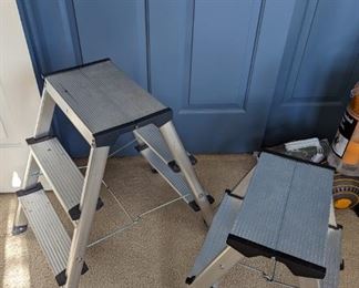 2 metal step stools.