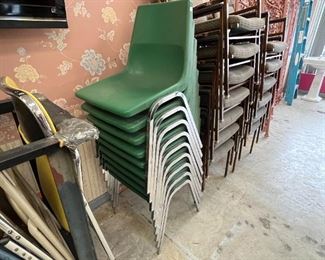 Approx. 58 Folding Chairs.  Stack of Green Chairs. Stack of Arm Chairs
