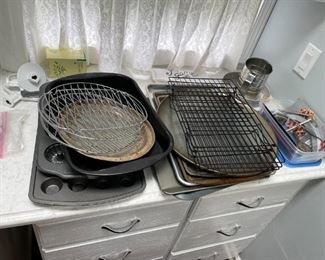 muffin tins, cookie pans, cooling racks, cooking supplies, cheese knives, sifter