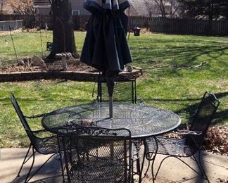 Vintage 5-Piece Wrought Iron Patio Dining Set, Including Table, 28.5" x 54" Diameter., Chairs, Qty 4, Umbrella, And Metal Stand