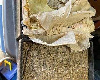 Old suitcase with baby clothes