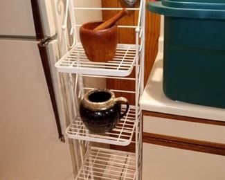 Narrow metal shelf