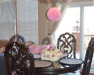 48” round wood table with custom glass top plus 4 chairs. (Ignore the decorative Tutus  and balloons)