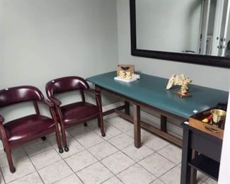 we have FOUR matching faux leather chairs on wheels, vintage exam table