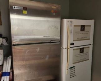 Kenmore refridgerator and a stainless steel warming cabinet