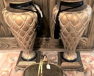 Two matching gold toned urns