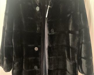 There are several fur coats