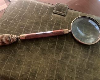 Embossed olive green legal pad cover; magnifying glass