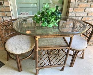 Small bamboo table - chairs tuck in neatly