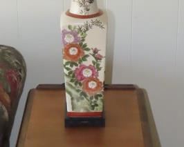 Antique end table and Asian themed table lamp.