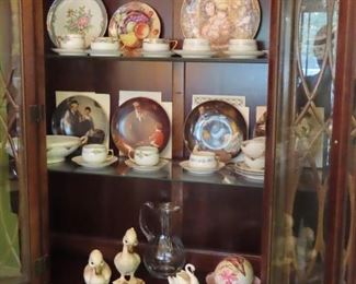 Bone china tea cups, Rockwell and Edna Hibel plates.