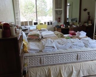 Master bedroom, adjustable bed,  sheets, comforters, linens.