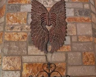 Large wings and wrought iron decor