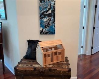 Trunk and a doll house with furniture in the bag