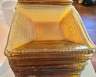 Dozens of amber dishes 