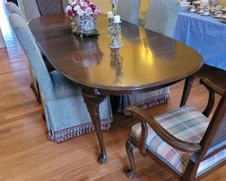 Queen Anne dining table, elegant upholstered side chairs