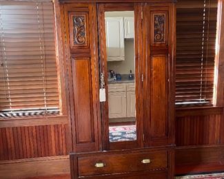 Lovely large armoire, mirrored, not overly deep, solid and in good condition. Some interior side shelves.