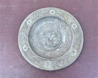 Small charger, pewter? with dog medallion.