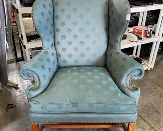 Green upholstered chair, brass tacks. 